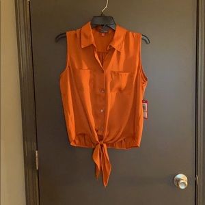NWT Sleeveless tie up blouse.